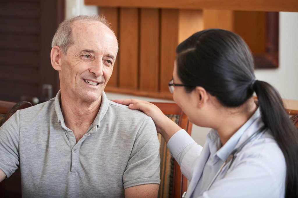 Careful doctor with senior man